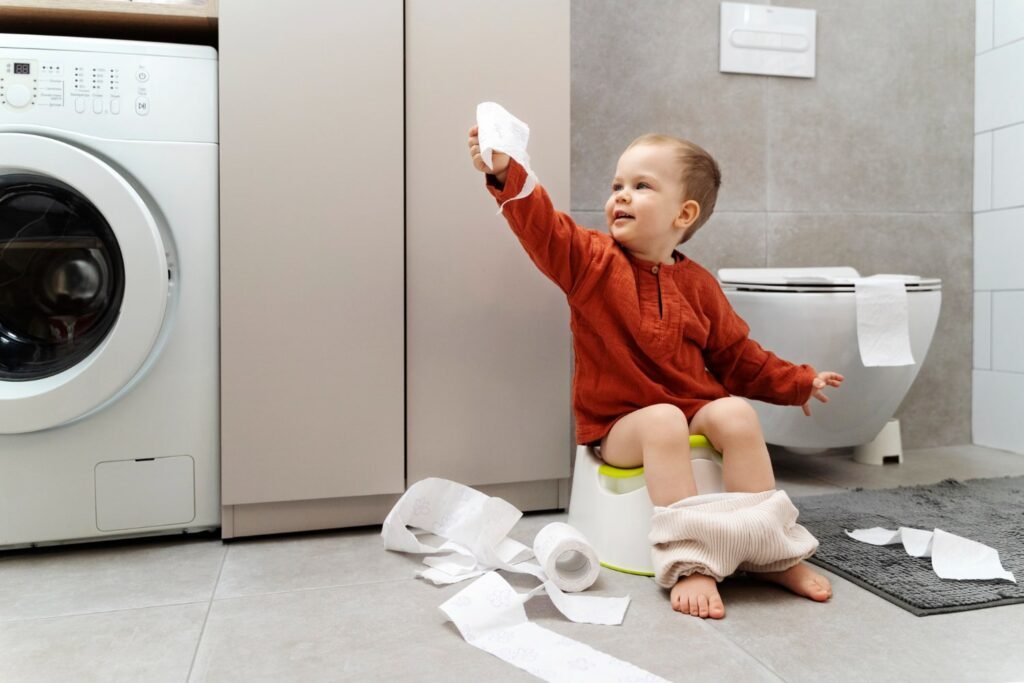 Child sitting on toilet